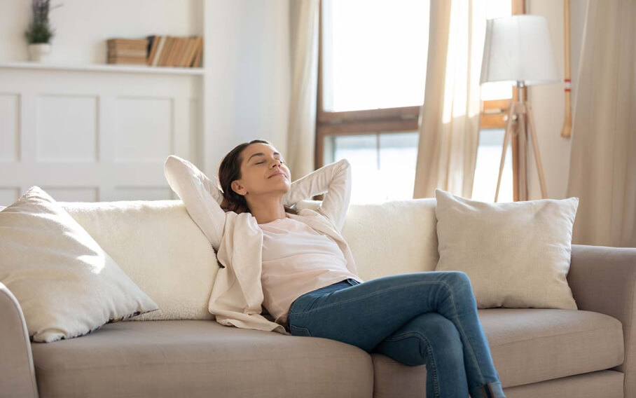 relaxing-on-couch-eyes-closed